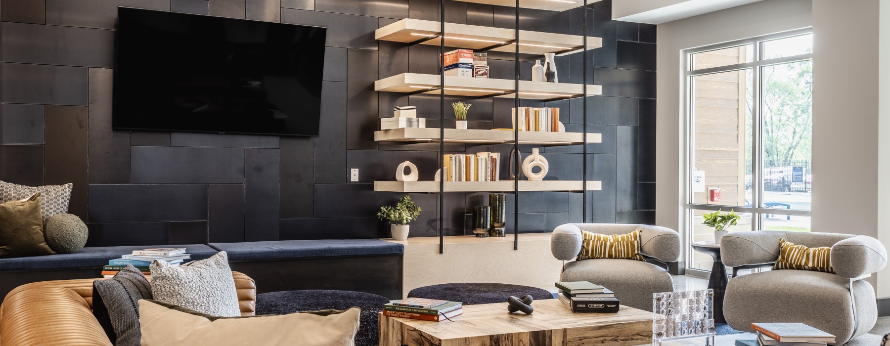 interior of apartment clubhouse with tv and decorative shelving