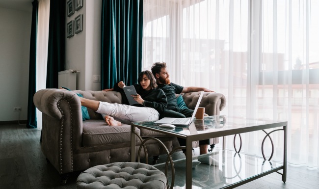 The Taylor Lifestyle lifestyle image of a couple resting on a big couch