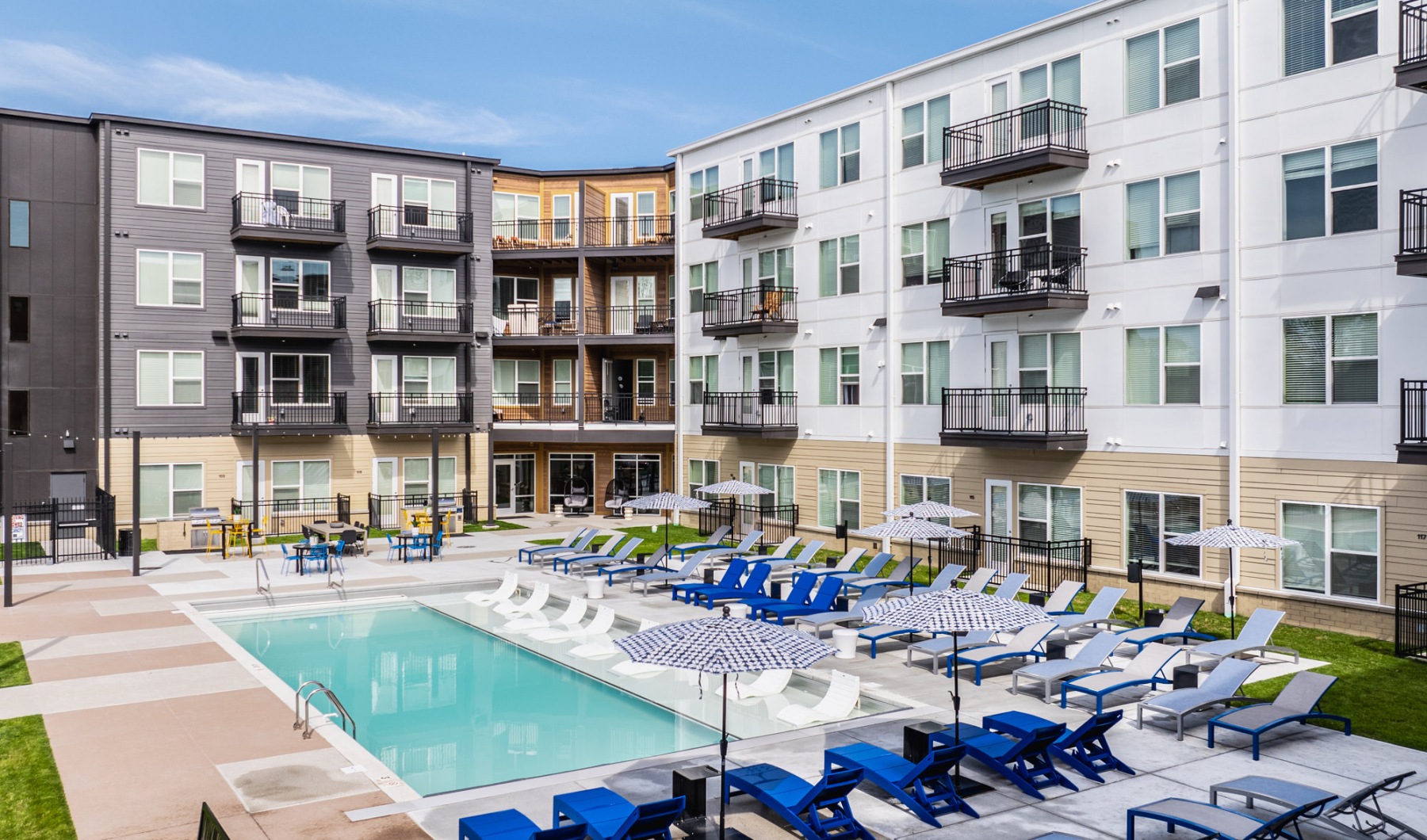 resort-style pool Resort-style swimming pool with lounge seating